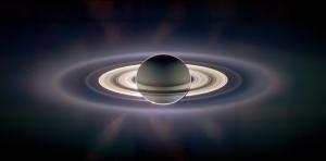 Light streams through Saturn's rings.