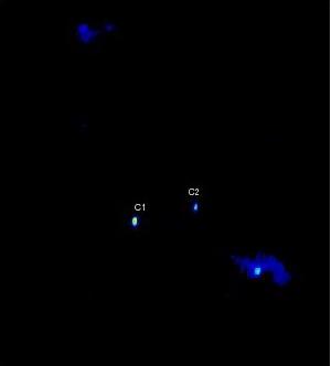 VLBA image of the central region of the galaxy 0402+379, showing the two cores, labeled C1 and C2, identified as a pair of supermassive black holes in orbit around each other.