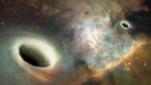 Artist's conception shows two supermassive black holes orbiting one another more than 750 million light years from Earth.