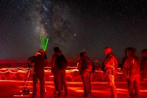 Stargazing while using red lights to perserve dark adaptness.