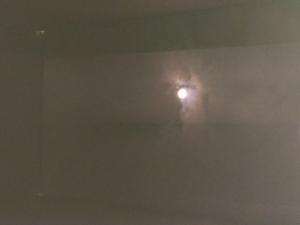 An image of the Sun and nearby clouds as seen through a pinhole camera.