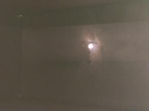 An image of the Sun and nearby clouds as seen through a pinhole camera.