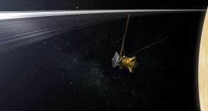 Illustration of NASA's Cassini spacecraft as it passes between Saturn and the planet's innermost set of rings.