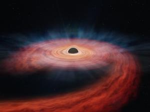 Illustration of the black hole ASASSN-14li.