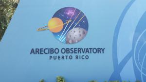 Sign at the entrance gate to the Arecibo Observartory.
