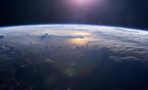 This view of Earth’s horizon as the Sun sets over the Pacific Ocean was taken by the Expedition 7 crew onboard the International Space Station in 2003.