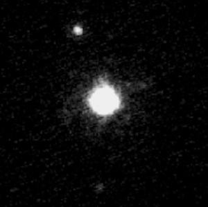 An image of Haumea with its two moons Hi’iaka and Naumaka.