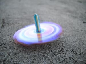A spinning top would fall just the same.