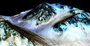 This digital false-colour image shows the dark, narrow streaks on Martian slopes inferred to be formed by seasonal flow of water on the planet.