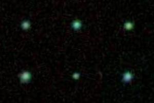 A montage of six Green Pea galaxies.