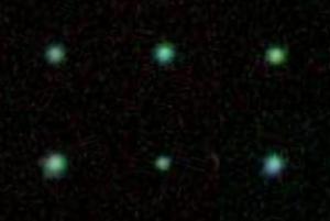 A montage of six Green Pea galaxies.
