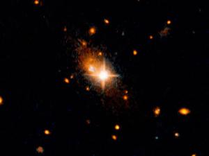 The galaxy 3C186, located about 8 billion years from Earth, is most likely the result of a merger of two galaxies.