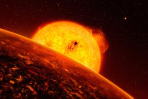 Artist view of Corot-7b, which orbits its Sun-like star very closely.