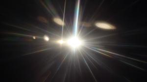 A powerful light shines in the dark.