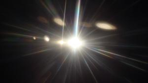 A powerful light shines in the dark.