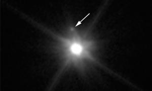 This Hubble image reveals the first moon ever discovered around dwarf planet Makemake.
