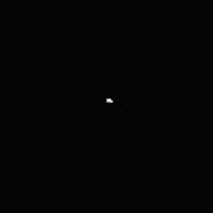 An actual image from within the asteroid belt, taken from the NEAR probe as it was heading toward Eros (center).