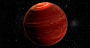 Artist conception shows an aurora over the polar region of a brown dwarf.