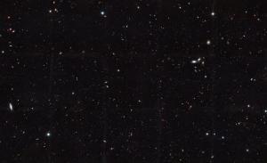 This Hubble Space Telescope view reveals thousands of galaxies stretching back into time across billions of light-years of space.