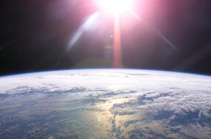 The Sun rises over the Earth as seen from the International Space Station.