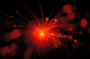 Laser light shining through fiber optic cables.
