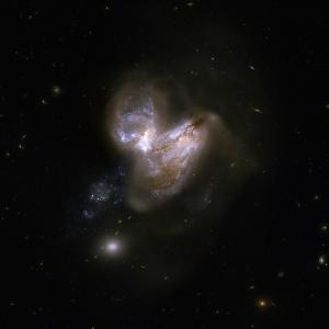 A Hubble image colliding galaxies known as Arp 299.
