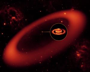 Artist's conception shows a nearly invisible ring around Saturn.