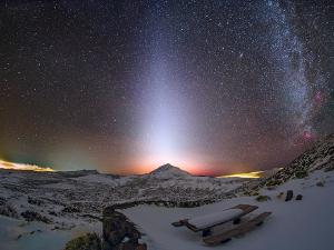 A column of zodiacal light stretches skyward beyond Mount Teide in the Canary Islands.