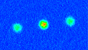 A beam of atoms split into three.