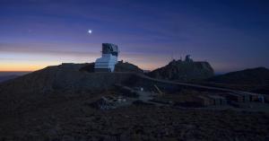 Rubin Observatory under a full moon in April 2022.