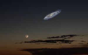 A composite image comparing the size of the Moon with the Andromeda galaxy.