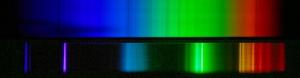 Top: The nearly continuous spectrum of the Sun. Bottom: The bright line spectrum of a compact florescent light.
