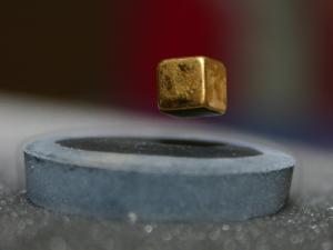 A superconductor levitating a magnet through the Meissner effect.