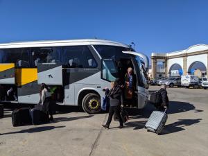 Five tourist busses arrived in the span of 20 minutes.